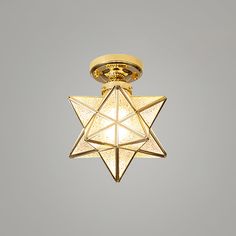 a star of david light hanging from the ceiling