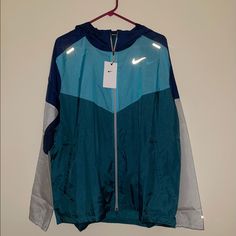 Nike Running Men's Jacket Windrunner Hoodie Gym Run Sports Db4091-451 Xl Blue Hooded Windbreaker For Gym, Moisture-wicking Sportswear Windbreaker For Running, Nike Moisture-wicking Windbreaker For Sports, Blue Moisture-wicking Windbreaker Sportswear, Nylon Windbreaker With Double-lined Hood For Sports, Nike Blue, Men's Jacket, Running Man, Nike Running