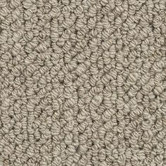 the texture of an upholstered carpet is shown in light brown and beige tones