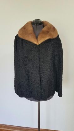 This STUNNING Vintage Gaylon / Schiaparelli PARIS black karakul sheep and mink collar coat is exactly what you need to help you stand out this season! High Quality makers / designers, clean, no signs of significant wear, no stains, ready to wear This coat is personalized by original owner "ABB", stitched into liner (see photo). All hook fasteners present and secure, 2 exterior pockets, one interior lining Monogrammed Pocket. No holes.   Size: Custom/Tailored. Vintage sizes don't always match current measurements. Please use my provided measurement (taken flat). Returns not accepted on vintage clothing.  Shoulders: 17 inches Sleeves: 18 inches Bust: 22 inches Flare: 26 inches Full Length: From base of collar 26 inches SHIPPING: I typically process and drop off to USPS by next day (except Su Black Embroidered Formal Outerwear, Traditional Evening Outerwear For Winter, Karakul Sheep, Collar Coat, Collared Coat, Custom Tailoring, Vintage Clothing, Vintage Black, Sheep