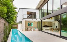 a modern house with a pool in the backyard