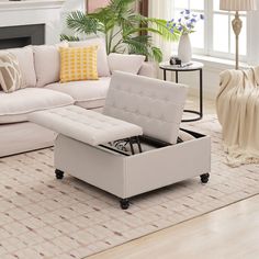 a living room filled with furniture and a fire place next to a couch on top of a rug