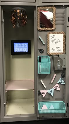 a locker with some writing on it and magnets attached to the doors that are open