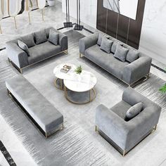 a modern living room with grey couches and tables in it's center area