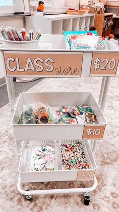 a class store cart with lots of items on it