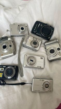 there are many different cameras on the bed