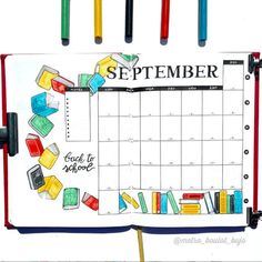 a calendar with pencils and markers attached to it