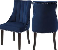 a pair of blue velvet chairs with studded trimmings on the back and sides