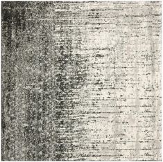 an area rug with grey and white colors on it, including the color scheme in shades of