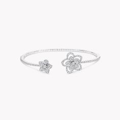 Two contrasting diamond flowers blossom side by side upon our Wild Flower bracelet, distinct yet complementary. Bursting with life, the flowers are connected by a delicate, beautifully articulated row of diamonds and realised with a wild touch that is unique down to every petal. Updating the traditional English Garden with carefree charm and a contemporary spirit, four varieties of flower flourish in rare abundance in our Wild Flower garden, inspiring you to mix, match and make everyday diamonds Graff Bracelet, Large Diamond Stud Earrings, Traditional English Garden, Wild Flower Garden, Graff Jewelry, Diamond Shaped Engagement Ring, Large Diamond Rings, Rare Diamonds, Bangle Diamond