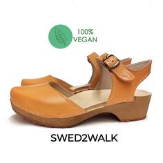 Vegan Swedish Clogs Sandals Orange Closed Toe Clogs With Rubber Sole, Orange Leather Round Toe Clogs, Orange Closed Toe Leather Clogs, Orange Leather Closed Toe Clogs, Orange Leather Clogs, Brown Clogs With Cork-bed Midsoles And Flat Heel, Brown Clogs With Wooden Flat Heel, Brown Clogs With Heel Loop And Round Toe, Brown Mules With Wooden Flat Heel