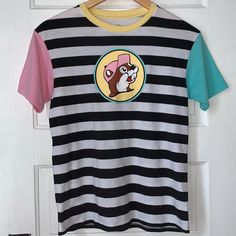 Buc-Ee’s Colorblock Black And White Striped Crewneck Tee. Screen Printed Buc-Ee Beaver Face On Front. Yellow Neckline, Pink And Blue Sleeves. Size Youth Medium (Fits Ladies Xs Maybe Small) Pit To Pit 17.5” Length 24” New Without Tags Polo Tee Shirts, Superman T Shirt, Striped Crewneck, Beige Shorts, Blue Camo, Blue T, Blue Tshirt, Graphic Tee Shirts, Boys T Shirts