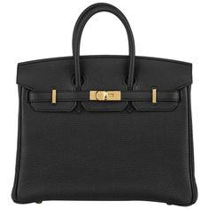 An exquisite Hermès 25cm Birkin bag. The exterior of this birkin is in black togo leather with tonal stitching. It features gold tone hardware with two straps and front toggle closure. The interior is lined with black chevre and has a zip pocket with an Hermès engraved zipper pull and an open pocket on the opposite side. This bag is store fresh, full set with factory stickers on all hardware. The bag measures 25cm L x 20cm H x 13cm D. The bag comes complete with Hermès box, raincoat, dust bag an Birken Bag Black, Birkin Bag Sticker, Hermes Bags Birkin, Black Birkin Bag, Birken Bag, Black Birkin, Hermes Birkin Bag, Birkin Bags, Expensive Bag