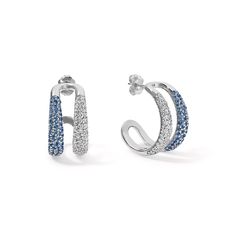 These exquisite earrings feature a harmonious blend of blue sapphires and diamonds, together they form a stunning composition that effortlessly captures attention. Perfect for making a statement or adding a pop of color to any outfit. Available in 14K White, Yellow, and Rose Gold Diamond weight = 0.99 carats Diamond quality = GH-Color, SI-Clarity Gemstone weight = 0.98 carats 18mm Inner Diameter 21.50mm long Gemstones are natural, therefore colors may vary Sapphire Earrings With Pave Setting In Fine Jewelry Style, Sapphire Earrings With Pave Setting, Modern Blue Earrings For Anniversary, Blue Diamond Earrings For Evening, Blue Diamond Earrings With Pave Setting, White Gold Sapphire Earrings With Pave Setting, Blue Sapphire Diamond Earrings, Modern Sapphire Gemstone Earrings, Blue Brilliant Cut Earrings For Evening