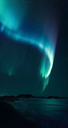 an aurora bore is seen in the night sky