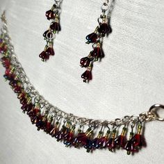 Turn Your Volume Up! Handmade Sensory Bracelet 7.25" Long Silver Tone Chain Loaded With Dangles Of Red Aurora Borealis Czech Glass Beads. Coordinating Pair Of Earrings Included, Silver Tone French Wire Hooks, 2.25" Long For Pierced Ears. New To Poshmark?? Use Code Plumloved To Save $10 On Your First Purchase!! #Jellyfishstuido #Handmade Handmade Glass Jewelry For Festive Occasions, Adjustable Glass Jewelry With Dangling Beads, Adjustable Red Beaded Dangle Bracelets, Red Jewelry With Bead Caps, Red Dangle Jewelry With Bead Caps, Red Czech Glass Bracelet, Red Czech Glass Jewelry With Spacer Beads, Adjustable Red Czech Glass Beads, Boho Rings Gold