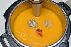 an overhead view of a bowl of soup with spices in it