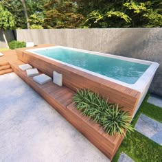 an outdoor swimming pool surrounded by greenery and wooden decking, with lounge chairs around it