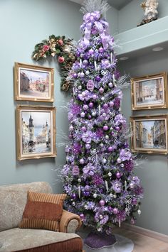 a purple christmas tree in a living room