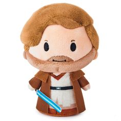 a star wars character plush toy with a toothbrush in it's mouth and brown hair