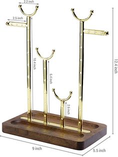 a wooden stand with two metal poles on it and measurements for each pole in the same size