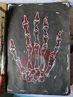 a hand is drawn on a piece of paper