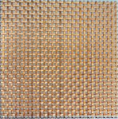 a close up view of a woven surface with small squares in the center and bottom