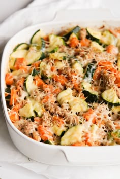 a casserole dish with zucchini and carrots