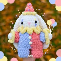 a small crocheted bunny holding balloons in it's hand with the caption happy easter