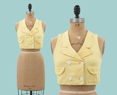 Vintage 30s/40s waistcoat. Buttery yellow twill cotton. Double pointed collar, double breasted front buttons and two front side pockets. Button closure (Pair or wear solo! State of garment | okay, overall wear with sun fading at shoulders, some faint marks on collars and in back, some wear under buttons and small marks (under multiple buttons). Buttons are not evenly aligned. refer to photos and request additional if needed. Buttons are a snug fit to insert.  Measurements ✂--- Best fit |  Small/ Medium  Bust | up to 34 " Shoulders  | 11 1/4" Shoulder to waist | not specified  Waist | 29" Total length | 14 1/2 " Tag | none present  ★★Visit The Shop★★ http://www.etsy.com/shop/seaofvintage ➸ Find the shop on Instagram for peekaboo sales & other earthly treasures.  Instagram | Seaofvintage Che Retro Cotton Vest With Buttons, Yellow Sleeveless Vest For Work, Vintage Buttoned Vest For Workwear, Vintage Vest With Buttons For Workwear, Vintage Workwear Vest With Buttons, Retro Workwear Vest With Button Closure, Retro Spring Vest For Workwear, Vintage Vest For Spring Workwear, Vintage Summer Vest For Workwear