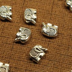 Elephant 11mm Antique Silver Tone Double Sided Animal Spacer Beads - 1462 by MothersCharms on Etsy Elephant Parade, Necklace And Bracelet, Ceramic Beads, Acrylic Beads, Bracelet Designs, Spacer Beads, Key Ring, Key Rings, Stone Beads