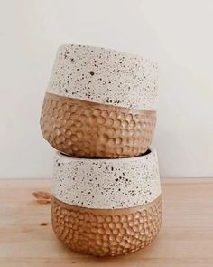 three ceramic bowls stacked on top of each other