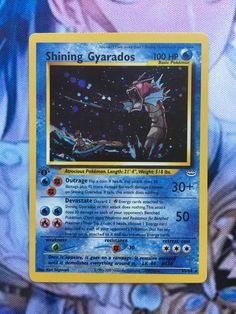 a pokemon card with an image of a man in space and stars on the back