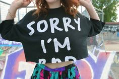 Sorry I'm... (bad) cropped sweatshirt. Cute crop style with cropped sleeves too. Has no tag to indicate brand or size, would say it fits as a large. Oversized Trendy Cropped Shirt, Grunge Cotton Crop Top With Letter Print, Trendy Slogan Cropped Shirt For Streetwear, Cotton Grunge Crop Top With Letter Print, Streetwear Cotton Cropped Shirt With Slogan, Cotton Cropped Shirt With Slogan For Streetwear, Trendy Long Sleeve Cropped Cotton T-shirt, Black Cotton Cropped Sweater, Edgy Cropped Letter Print Crop Top