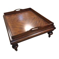 a wooden tray with handles on it