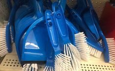 several blue and white brushes are stacked on top of each other