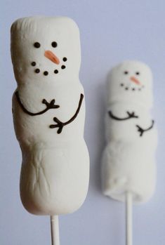 two marshmallows with snowmen on them