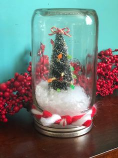 a snow globe with a christmas tree in it