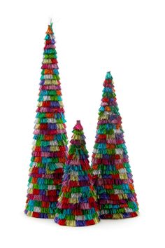 three brightly colored christmas trees on a white background