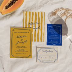 the wedding stationery is laid out on paper