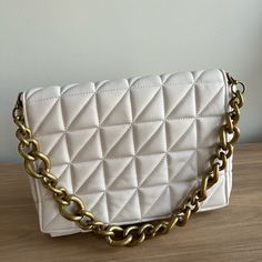 New Without Tag Zara Quilted Bag Made With Faux Leather Material And Has Golden Chain Strap. Condition: Like New Color: Ivory Material: Faux Leather Chic White Pouch Satchel, White Tote Bag With Chain Strap, Trendy Cream Bag With Gold-tone Hardware, White Tote Shoulder Bag With Chain Strap, Trendy Cream Bags With Gold-tone Hardware, White Square Shoulder Bag With Gold-tone Hardware, White Rectangular Shoulder Bag With Gold-tone Hardware, Everyday Cream Bag With Chain Strap, Chic Cream Bag With Chain Strap