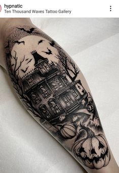 a black and white photo of a house with pumpkins on it's arm