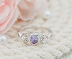 Precious sterling silver birthstone ring for children with a heart-shaped Amethyst CZ stone or February birthstone. These are high-quality rings with rhodium plating to prevent tarnish for little girls, toddlers, kids, and children. The are great pinky rings as well. This comes in a black velvet heart ring box and is available in sizes 1-5. Ring Sizing: https://cherishedmomentsshop.com/pages/sizing-charts Silver Heart-shaped Birthstone Ring Gift, Silver Amethyst Ring For Valentine's Day Gift, Silver Cubic Zirconia Birthstone Ring For Valentine's Day, Silver Heart Birthstone Ring For Mother's Day, Heart Shaped Silver Birthstone Ring For Mother's Day, Silver Heart-shaped Birthstone Ring For Mother's Day, Silver Heart Ring For May Birthstone Gift, Heart Cut Birthstone Rings For Birthday, Heart Cut Birthstone Rings For Birthdays