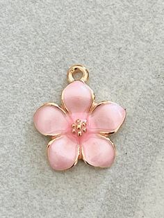 3 dainty pink enamel and gold tone flower charms - pearlized design shiny petals - gold centerListing is for 3 charmsShiny pink enamel flowers Gold tonePearlized shiny petals Daisy flowerNature Flower charmsBouquet Bracelet- necklace - pendant Children’s jewelryPerfect for all your DIY creations Measurement 17mm x 15mm***Although I try hard to represent actual colors, color may vary due to lighting depicted on computer monitors and mobile devices.*** Pink Dainty Jewelry With Flower Charm, Gold Jewelry With 3d Petal Flowers, Delicate Pink Jewelry With Flower Charm, Feminine Pink Flower Necklace With Flower Charm, Pink Enamel Dainty Jewelry, Pink Enamel Jewelry With Charms, Pink Flower Charm Necklace With Flower Pendant, Delicate Pink Flower Charm Jewelry, Pink Enamel Jewelry With Flower Charm