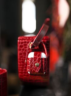 a red purse sitting on top of a table