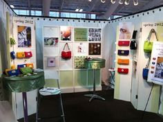 a room with several different types of handbags on display