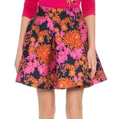 A Bright Floral Zac Posen Miniskirt With A Flirty, Pleated Silhouette. On-Seam Hip Pockets. Hidden Back Zip. Lined. Fabric: Mid-Weight Brocade. 90% Polyester/10% Polyamide. Dry Clean. Measurements Length: 18in / 46cm Measurements From Size 6 Spring Silk A-line Skirt, Feminine Pink A-line Skirt, Pink A-line Bottoms For Party, Pink A-line Pleated Skirt, Silk A-line Skirt, Silk Full Skirt With Floral Print, Chic Pink Skirt For Cocktail, Pink Silk Pleated Skirt, Spring Pink A-line Bottoms