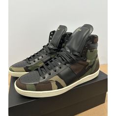 Saint Laurent Camouflage Black Sl10h High Top Sneakers Size Us Mens 12. Eu Size Is 45 In Brand New Unworn Condition. Comes With The Og Box, Fabric Bags, Extra Laces, And A Certificate Of Authenticity Card. Box Has Some Sharpie Marks Done For Inventory Tracking But Not A Big Deal. The Right Shoe Bottom Sole Has Turned A Little Yellow Due To Age/Storage As Shown In Pictures, But Not Noticeable From A Distance When You Wear Them. Open To Offers. Camouflage Lace-up Sneakers For Streetwear, Low-top Camouflage Sneakers With Rubber Sole, Camouflage Round Toe Sneakers For Streetwear, Camouflage Round Toe Sneakers For Sports, Camouflage Sneakers With Round Toe For Sports, Casual Leather Camouflage Sneakers, Casual Camouflage Leather Sneakers, Leather High-top Sneakers For Sports With Branded Heel Counter, Camouflage High-top Sneakers With Rubber Sole