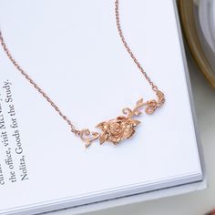 Disney Rose Gold Belle's Roses Necklace 16-19"– Think Goodness Rose Gold Flower Pendant Necklace With Roses, Rose Gold Necklace With Flower Pendant, Rose Gold Necklace With Flower Pendant And Roses, Dainty Rose Gold Necklace With Rose Design, Delicate Rose Gold Necklaces With Roses, Elegant Roses Necklace For Mother's Day, Rose Gold Jewelry With Roses For Her, Valentine's Day Rose Gold Necklaces With Rose Design, Rose Gold Necklace With Rose Design For Gift