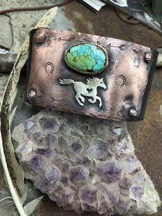 Made to order! All turquoise varies in color and size. Running free cuff bracelet by Weathered Soul, horse lover, equestrian, cowgirl, rustic cuff, artisan cuff, horse cuff, turquoise cuff, USA. Bronze snap set at approx. 7 and 8 inches. Copper hammered and riveted to recycled leather distressed black belt with sterling horse and sterling bezel set turquoise matrix stone. Artisan made in the USA. Please feel free to convo me with any questions.  Note*  Listing is just for the horse cuff. Other cuffs sold separately. Handmade Western Style Turquoise Bracelet, Handmade Western Turquoise Bracelet, Handmade Western Turquoise Bracelets, Adjustable Western Cuff Bracelet With Patina, Handmade Turquoise Western Cuff Bracelet, Western Patina Cuff Bracelet Gift, Handmade Western Style Cuff Bracelet, Handmade Western Cuff Bracelet As Gift, Rustic Handmade Turquoise Cuff Bracelet